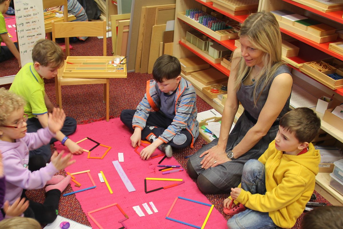 A guide working with children