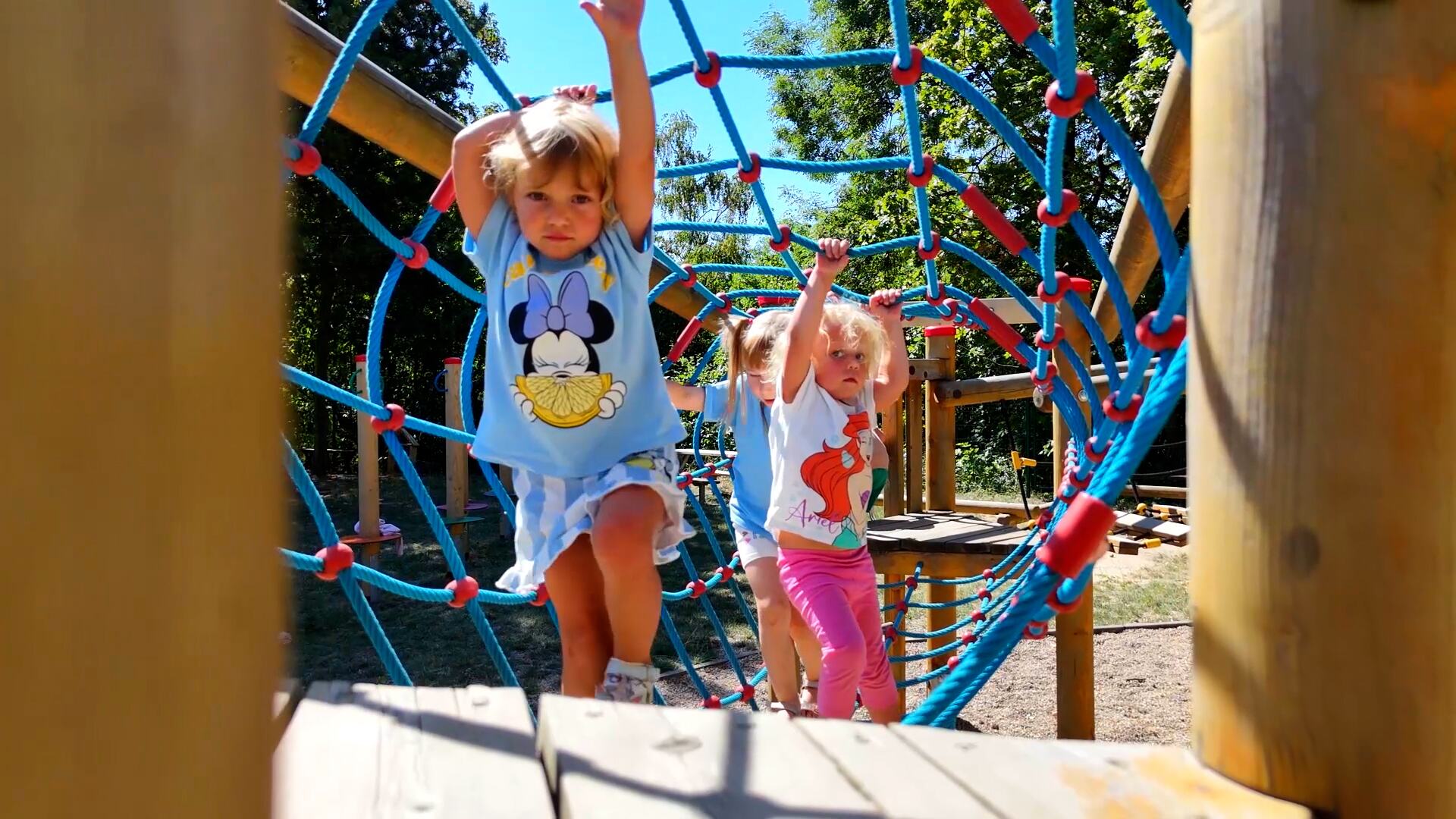Children on the climbing net in the school garden